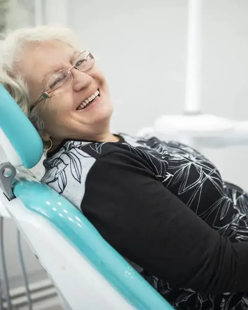 Smiling senior woman in a dental chair